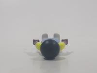 1995 Geobra Playmobil Small Black Haired Boy Child Blue Pants Two Tone Blue and Fluorescent Green Sleeved Shirt 2 1/8" Tall Toy Figure