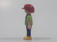 1995 Geobra Playmobil Small Brunette Boy Child Blue Pants Orange and Blue Striped Green Shirt Red Cap 2 1/8" Tall Toy Figure