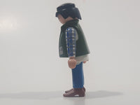 1994 Geobra Playmobil Black Hair Blue Pants White Blue and Grey Plaid Shirt with Olive Green Vest 2 3/4" Tall Toy Figure