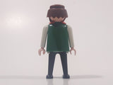 1974 Geobra Playmobil Brown Hair and Beard Black Pants White and Green Top with Red Scarf 2 3/4" Tall Toy Figure