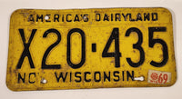 1969 November Wisconsin America's Dairyland Black Letters Yellow Vehicle License Plate Tag X20 435