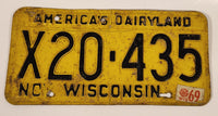 1969 November Wisconsin America's Dairyland Black Letters Yellow Vehicle License Plate Tag X20 435