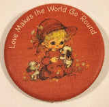 1983 Hallmark Cards Love Makes the World Go Round Girl in Red with Puppy Dogs 2 1/4" Thin Fabric Covered Round Button Pin