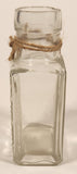 Vintage Kuowow's Powder Heavy Embossed Glass Bottle
