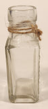 Vintage Kuowow's Powder Heavy Embossed Glass Bottle
