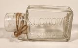 Vintage Kuowow's Powder Heavy Embossed Glass Bottle