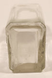 Vintage Kuowow's Powder Heavy Embossed Glass Bottle