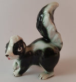 Vintage Porcelain Skunk Figurine with Tongue Out - Treasure Valley Antiques & Collectibles