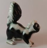 Vintage Porcelain Skunk Figurine with Tongue Out - Treasure Valley Antiques & Collectibles