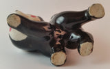 Vintage Porcelain Ceramic Playful Skunk Figurine - Treasure Valley Antiques & Collectibles