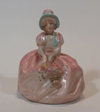 Vintage Chalkware Sitting Girl in Victorian Pink Dress with Bonnet and Flower Basket Figurine - Treasure Valley Antiques & Collectibles