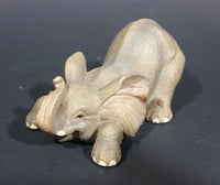 Elephant Figurine Laying Down with Trunk Upwards Marked ©97 WUI - Treasure Valley Antiques & Collectibles