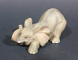 Elephant Figurine Laying Down with Trunk Upwards Marked ©97 WUI - Treasure Valley Antiques & Collectibles