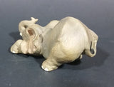 Elephant Figurine Laying Down with Trunk Upwards Marked ©97 WUI - Treasure Valley Antiques & Collectibles