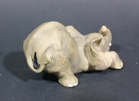 Elephant Figurine Laying Down with Trunk Upwards Marked ©97 WUI - Treasure Valley Antiques & Collectibles