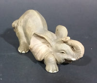 Elephant Figurine Laying Down with Trunk Upwards Marked ©97 WUI - Treasure Valley Antiques & Collectibles