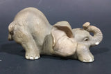 Elephant Figurine Laying Down with Trunk Upwards Marked ©97 WUI - Treasure Valley Antiques & Collectibles