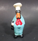 Vintage Black Duck in a Blue Suit Chef Cook Figurine Holding a Bottle of Bubbly - Treasure Valley Antiques & Collectibles