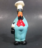 Vintage Black Duck in a Blue Suit Chef Cook Figurine Holding a Bottle of Bubbly - Treasure Valley Antiques & Collectibles