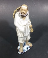 Vintage Balding Man with a Beard in a White Robe With a Tan Hat Ceramic Figurine - Treasure Valley Antiques & Collectibles