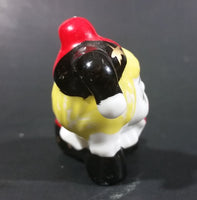 Decorative Ceramic Jester Laying Down Sleeping Dreaming Figurine w/ Red & Black Costume - Treasure Valley Antiques & Collectibles