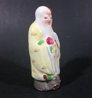 Vintage Chinese God Shou Wiseman in a Yellow Robe with Red Staff holding Fruit Ceramic Figurine - Treasure Valley Antiques & Collectibles