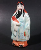 Vintage Chinese Wiseman in a Light Blue Robe with Red Item in Hand Figurine - Treasure Valley Antiques & Collectibles