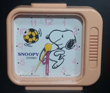 Vintage 1958 Citizen United Feature Syndicate Snoopy Playing Soccer Pink Alarm Clock Collectible - Treasure Valley Antiques & Collectibles