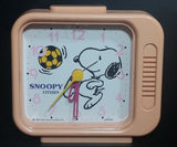 Vintage 1958 Citizen United Feature Syndicate Snoopy Playing Soccer Pink Alarm Clock Collectible - Treasure Valley Antiques & Collectibles