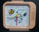 Vintage 1958 Citizen United Feature Syndicate Snoopy Playing Soccer Pink Alarm Clock Collectible - Treasure Valley Antiques & Collectibles