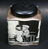 Black and White Photograph Cocoa Storage Tin of a Boy and a Girl Sitting in Different Scenes - Treasure Valley Antiques & Collectibles