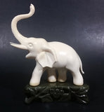 Vintage White Ivory Look Plastic Elephant on Rock Looking Stand with Trunk Up Made in Hong Kong - Treasure Valley Antiques & Collectibles