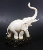 Vintage White Ivory Look Plastic Elephant on Rock Looking Stand with Trunk Up Made in Hong Kong - Treasure Valley Antiques & Collectibles