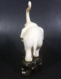 Vintage White Ivory Look Plastic Elephant on Rock Looking Stand with Trunk Up Made in Hong Kong - Treasure Valley Antiques & Collectibles
