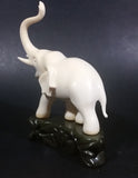 Vintage White Ivory Look Plastic Elephant on Rock Looking Stand with Trunk Up Made in Hong Kong - Treasure Valley Antiques & Collectibles