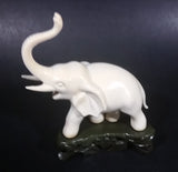 Vintage White Ivory Look Plastic Elephant on Rock Looking Stand with Trunk Up Made in Hong Kong - Treasure Valley Antiques & Collectibles