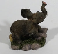 Elephant with Tusks Holding Trunk Upwards Resin Figurine - SABRE - Treasure Valley Antiques & Collectibles