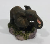Elephant with Tusks Pulling a Log With It's Trunk Resin Figurine - SABRE - Treasure Valley Antiques & Collectibles