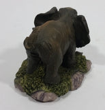 Elephant with Tusks Pulling a Log With It's Trunk Resin Figurine - SABRE - Treasure Valley Antiques & Collectibles