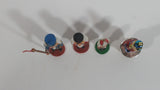 Three Small Christmas Nutcracker Figures and One Bottle Cork Nutcracker