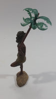 Man Holding a Palm Tree Umbrella While Standing on One Foot Resin and Plastic Figurine