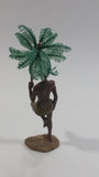 Man Holding a Palm Tree Umbrella While Standing on One Foot Resin and Plastic Figurine