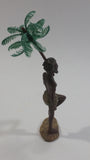 Man Holding a Palm Tree Umbrella While Standing on One Foot Resin and Plastic Figurine