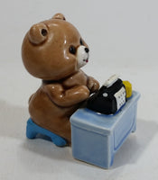 Cute Brown Bear Typing on Black Typewriter While Sitting At A Blue Desk Ceramic Figurine Made in Japan