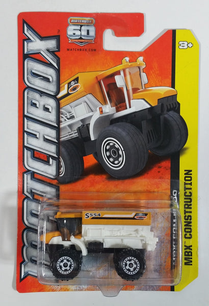 2013 Matchbox MBX Construction FRM 6000 (Sowing Machine) Dump Truck White and Yellow Orange Die Cast Toy Car Vehicle New In Package Sealed