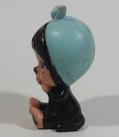 Vintage 1979 Sekiguchi Monchichi Girl Sitting with Blue Bonnet Head Scarf 2" Tall PVC Toy Figure