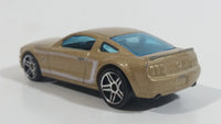 2007 Hot Wheels 2005 Ford Mustang GT Champagne Gold Die Cast Toy Car Vehicle