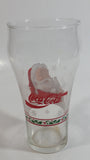 Enjoy Coca-Cola Santa Claus Holding a Bottle with Snowflakes and Holly Border Christmas Holiday Themed 6" Tall Glass Cup