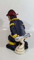 Fireman Firefighter Holding A Young Child Heavy Wine Bottle Holder Sculpture 9 1/2" Tall