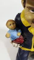 Fireman Firefighter Holding A Young Child Heavy Wine Bottle Holder Sculpture 9 1/2" Tall